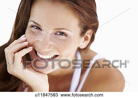 Studio portrait of woman smiling View Large Photo Image Stock Image - Studio portrait of woman smiling. Fotosearch