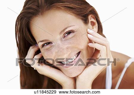 Stock Photo - Studio portrait of woman smiling. Fotosearch