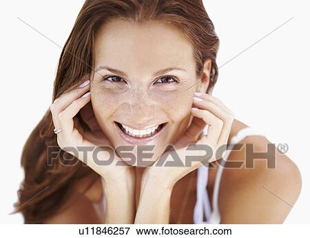 Stock Photo - Studio portrait of woman smiling. Fotosearch