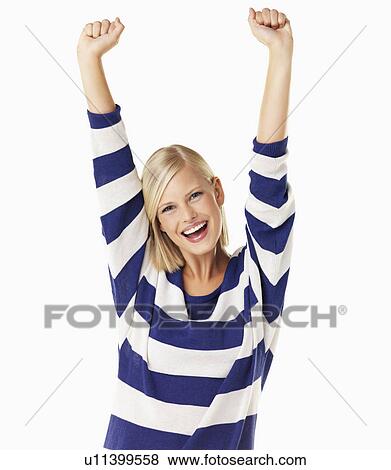 Studio portrait of young woman cheering View Large Photo Image Stock Photo - Studio portrait of young woman cheering. Fotosearch
