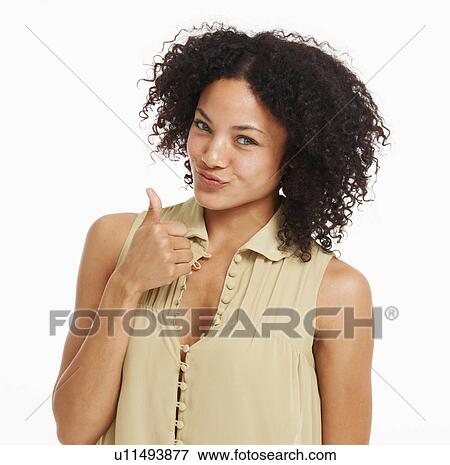 Stock Photo - Studio portrait of young woman gesturing. Fotosearch