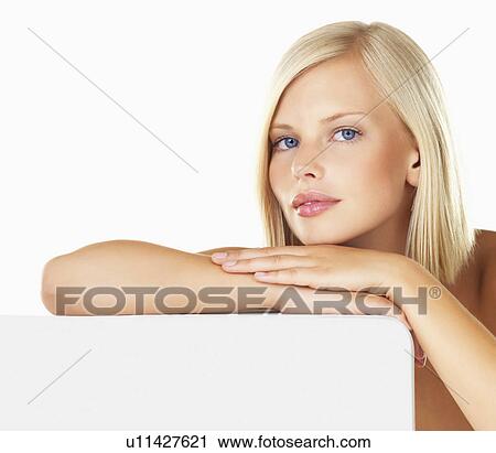 Stock Image - Studio portrait of young woman. Fotosearch