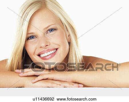 Stock Image - Studio portrait of young woman. Fotosearch