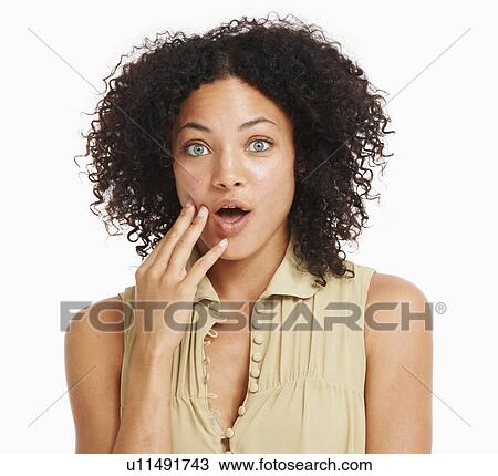 Stock Image - Studio portrait of young woman. Fotosearch