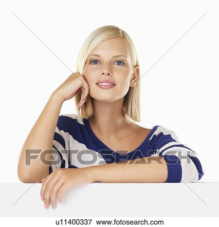 Studio portrait of young woman View Large Photo Image Stock Photo - Studio portrait of young woman. Fotosearch