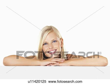 Stock Photography - Studio portrait of young woman. Fotosearch
