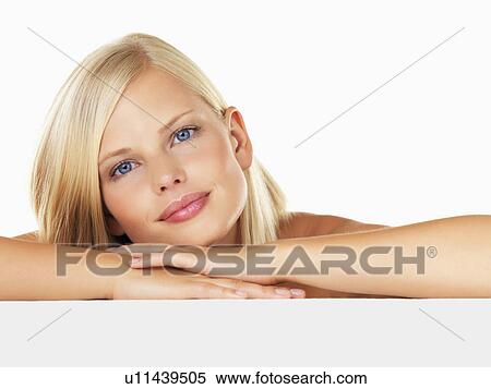 Studio portrait of young woman View Large Photo Image Stock Photography - Studio portrait of young woman. Fotosearch