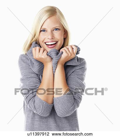 Studio portrait of young woman wearing gray sweater View Large Photo Image Stock Image - Studio portrait of young woman wearing gray sweater. Fotosearch