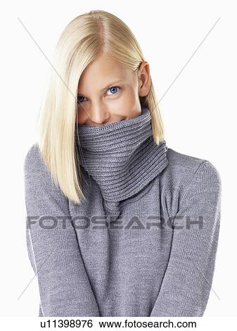Studio portrait of young woman wearing gray sweater View Large Photo Image Stock Photograph - Studio portrait of young woman wearing gray sweater. Fotosearch