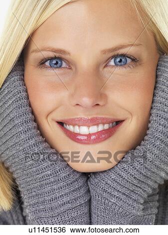 Studio portrait of young woman wearing gray sweater View Large Photo Image Stock Photograph - Studio portrait of young woman wearing gray sweater. Fotosearch