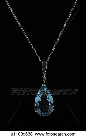 Stock Photo - Studio shot of beautiful necklace with blue stone. Fotosearch