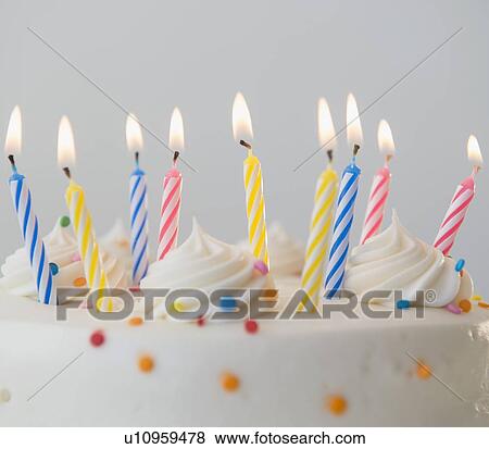 Studio shot of birthday cake with lit candles View Large Photo Image Stock Photo - Studio shot of birthday cake with lit candles. Fotosearch