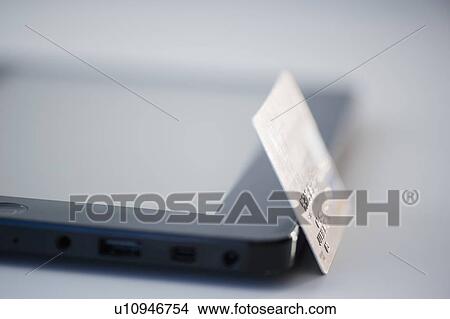 Picture - Studio Shot of digital tablet and credit card. Fotosearch