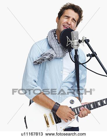 Studio shot of man singing View Large Photo Image Stock Image - Studio shot of man singing . Fotosearch