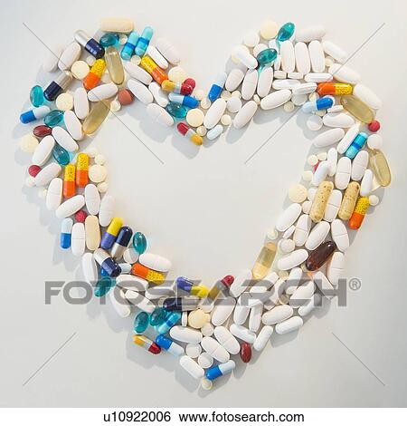 Studio shot of pills forming heart shape View Large Photo Image Stock Photograph - Studio shot of pills forming heart shape. Fotosearch