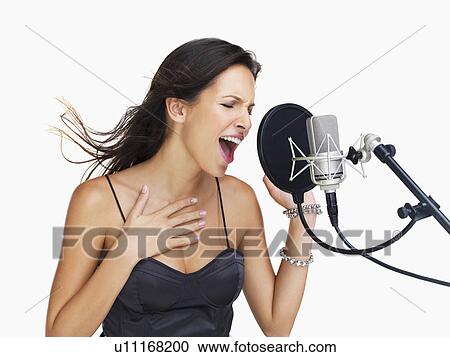 Studio shot of singing rockstar View Large Photo Image Stock Image - Studio shot of singing rockstar. Fotosearch