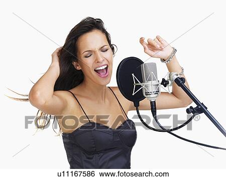 Studio shot of singing rockstar View Large Photo Image Stock Photograph - Studio shot of singing rockstar. Fotosearch