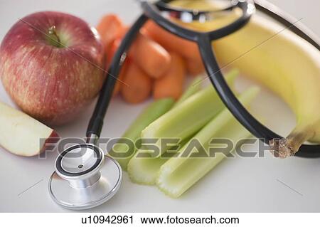 Studio shot of stethoscope with fruits and vegetables View Large Photo Image Stock Image - Studio shot of stethoscope with fruits and vegetables. Fotosearch