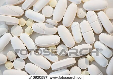 Stock Photo - Studio shot of white pills. Fotosearch
