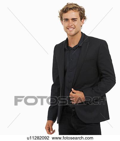 Stock Image - Studio Shot of young man wearing black jacket and shirt. Fotosearch