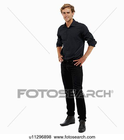 Stock Photo - Studio Shot, Portrait of man with hands on hips. Fotosearch