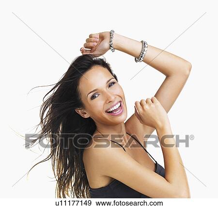Studio Shot, Portrait of smiling young woman with raised arms View Large Photo Image Stock Photo - Studio Shot, Portrait of smiling young woman with raised arms. Fotosearch