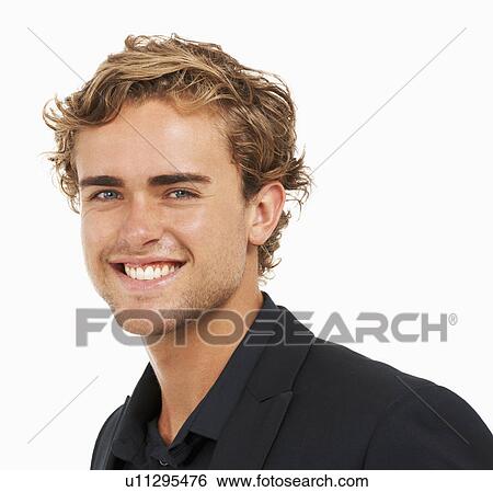 Studio Shot, Portrait of smiling young man View Large Photo Image Stock Photograph - Studio Shot, Portrait of smiling young man. Fotosearch