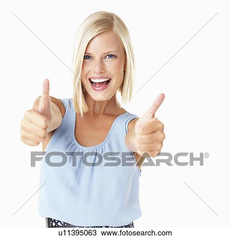 Studio Shot, Portrait of young woman with thumbs up View Large Photo Image Stock Image - Studio Shot, Portrait of young woman with thumbs up. Fotosearch