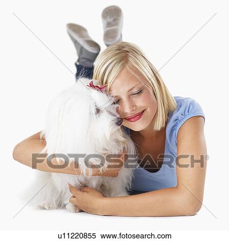 Studio Shot, Portrait of young woman hugging her dog View Large Photo Image Stock Photography - Studio Shot, Portrait of young woman hugging her dog. Fotosearch
