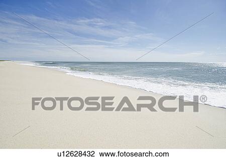 Stock Image - Tranquil sandy beach. Fotosearch