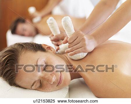 Two people getting massage in spa View Large Photo Image Stock Photography - Two people getting massage in spa. Fotosearch