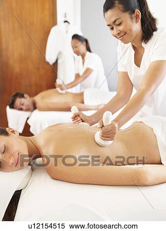 Two people getting massage in spa View Large Photo Image Stock Photography - Two people getting massage in spa. Fotosearch