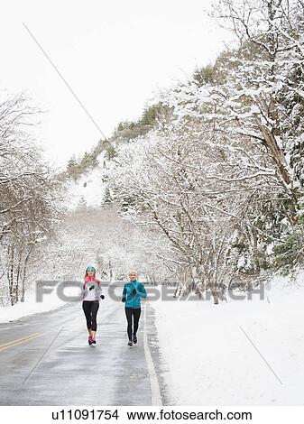 Picture - Two women jogging in winter . Fotosearch