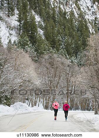 Two women jogging in winter View Large Photo Image Stock Photograph - Two women jogging in winter . Fotosearch