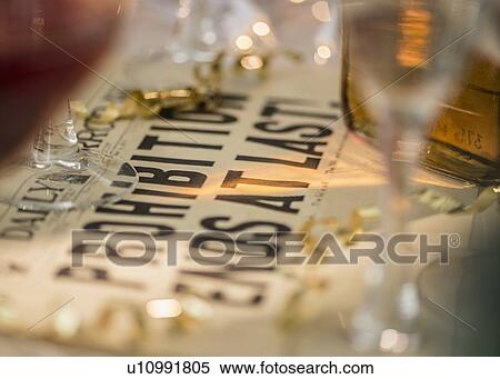 Vintage newspaper on table with alcohol View Large Photo Image Stock Photography - Vintage newspaper on table with alcohol. Fotosearch
