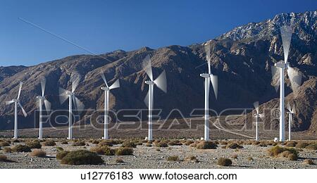 Stock Image - Wind turbines on desert. Fotosearch