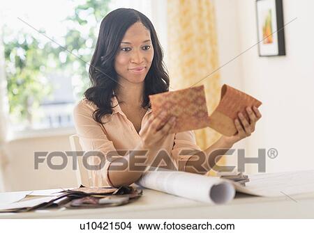 Woman choosing color swatches View Large Photo Image Picture - Woman choosing color swatches. Fotosearch