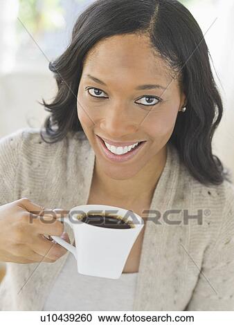 Woman drinking coffee View Large Photo Image Stock Image - Woman drinking coffee. Fotosearch
