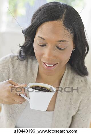 Stock Photograph - Woman drinking coffee. Fotosearch