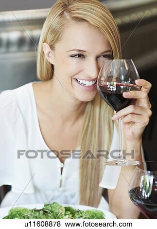 Stock Photo - Woman drinking wine. Fotosearch