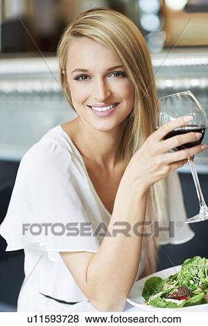 Woman eating lunch in restaurant View Large Photo Image Stock Photo - Woman eating lunch in restaurant. Fotosearch