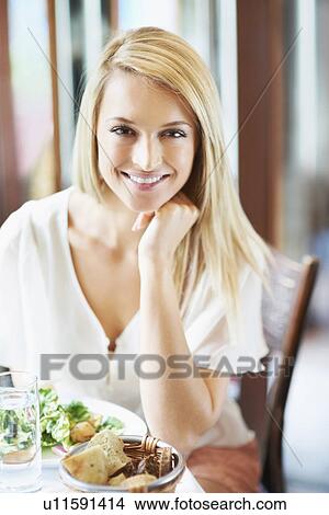 Woman eating lunch View Large Photo Image Picture - Woman eating lunch. Fotosearch