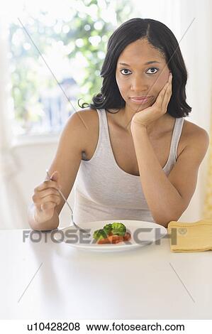 Woman eating vegetables View Large Photo Image Stock Photo - Woman eating vegetables. Fotosearch