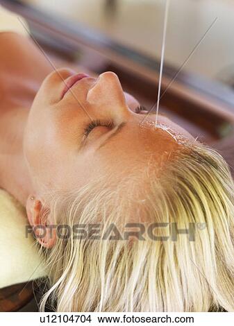 Picture - Woman getting aromatherapy in spa. Fotosearch