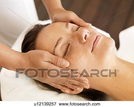 Woman getting facial massage in spa View Large Photo Image Stock Photo - Woman getting facial massage in spa. Fotosearch