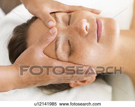 Woman getting facial massage in spa View Large Photo Image Stock Photography - Woman getting facial massage in spa. Fotosearch