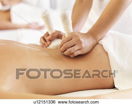 Woman getting massage in spa View Large Photo Image Stock Photograph - Woman getting massage in spa. Fotosearch