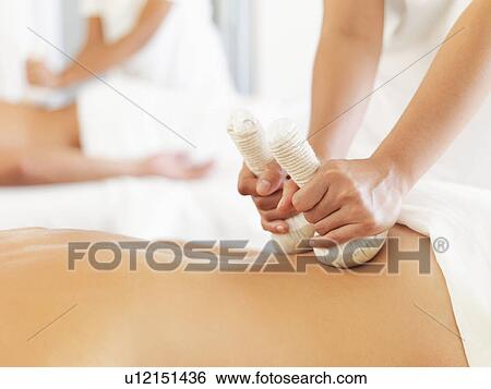 Woman getting massage in spa View Large Photo Image Stock Photograph - Woman getting massage in spa. Fotosearch