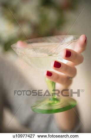 Stock Photo - Woman holding champagne . Fotosearch