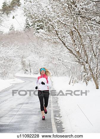 Stock Photo - Woman jogging in winter . Fotosearch